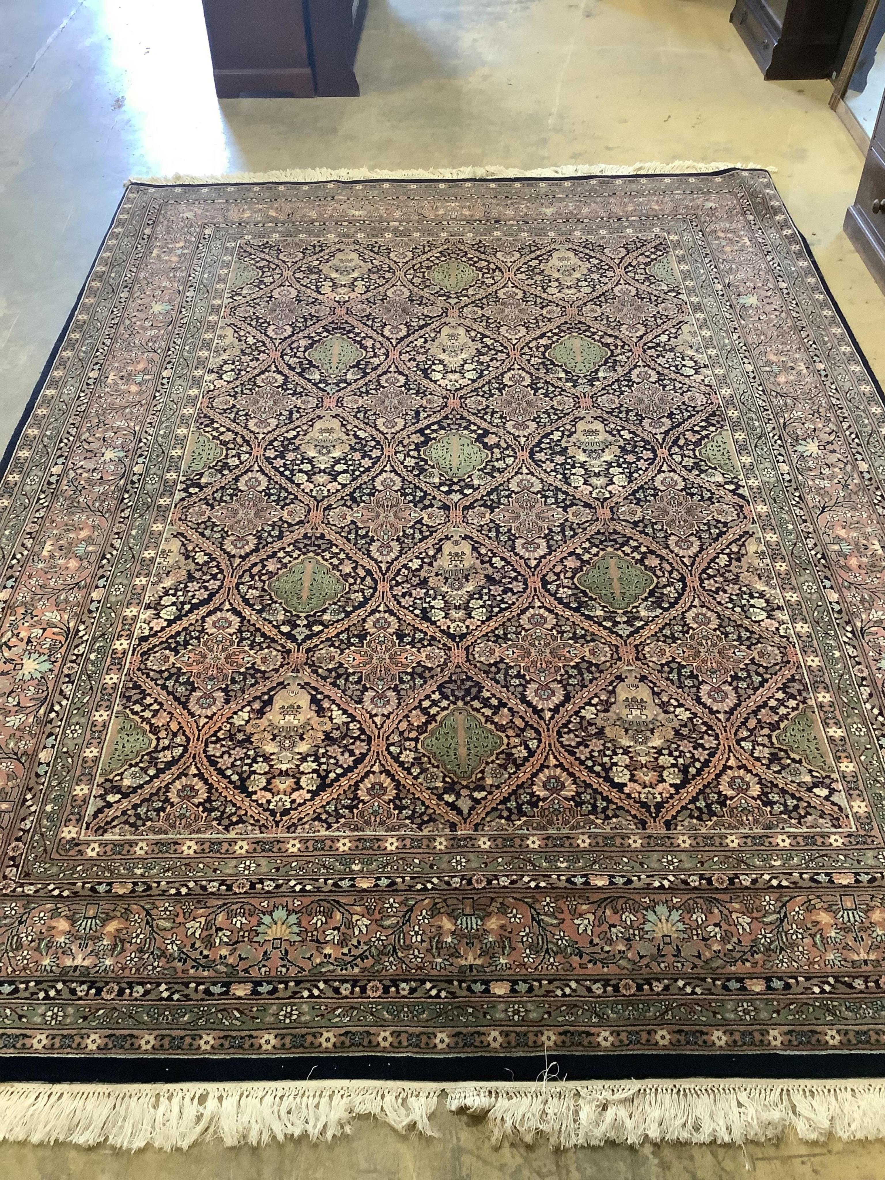 An Indian wool carpet, 372 x 274cm. Condition - good